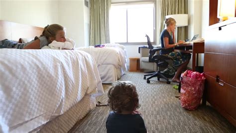 mom and son in a hotel|Mother Son Hotel Room royalty.